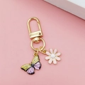 Golden daisy and butterfly keychain pendant for women bags with floral charms - Pink Daisy