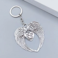 Detail view of silver angel wings keychain with engraved heart tag and sentimental quote - Always In My Heart Style (LQ-01865 E#)