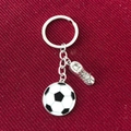 Detail of silver metal soccer keychain with classic ball and textured boot pendant - Antique Silver Soccer Shoe Pendant