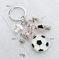 Detailed view of soccer keychain featuring football jersey shoe and heart charm pendants - Antique Silver Shoe Jersey Style