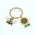 Porte-clés doré avec charms tournesol et abeille en émail et métal de haute qualité - Style Abeille et Tournesol