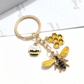 Porte-clés abeille créatif avec breloques en émail jaune et anneau en métal doré - Style Abeille Nid d'abeille et Pot de Miel