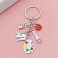 Dettaglio del portachiavi per insegnanti in metallo con mela rossa e ciondolo #1 Teacher - Stile Tavolozza e Pennello (LQ-01893-2#)