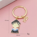 Porte-clés de remise de diplôme 2025 doré avec breloque d'étudiant et année, 61mm - Personnage De Dessin Animé En Robe De Diplômé (2025)