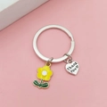 Close-up of metal keychain with yellow flower charm and Thank You engraved heart pendant - Yellow Flower