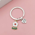 Plumeria flower keychain with silver Thank You heart charm on a pink background - Small White Flower