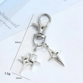 Silver alloy four-pointed star keychain with lobster clasp and dimensional charms detail - Silver Solid and Hollow Star Combo (LQ-815-D)