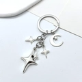 Porte-clés en alliage argenté poli avec breloques lune et étoiles à quatre branches - Petit Pendentif Étoile Lune