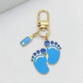 Cute baby theme keychain with blue footprints and baby bottle charms in gold alloy - Blue Footprint Bottle Lobster Clasp