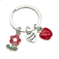 Porte-clés argenté avec pomme émaillée rouge, petite fleur et pendentif Thank You - Style Fleur Rouge