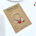 Porte-clés de remerciement avec pomme rouge et fleur rose sur carte cadeau - Pack Carte Fleur Rose