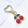 Golden heart-shaped cherry keychain with red translucent beads and green leaves - Red Cherry Green Leaf Heart Hook