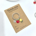 Porte-clés pomme en émail Thank You sur carte cadeau en papier kraft brun - Pack Carte Fleur Jaune