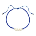 Detail of adjustable blue woven bracelet with white freshwater pearls and golden bead accents - Dark Blue Style (QQ414)