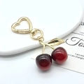 Golden heart buckle cherry keychain featuring glossy dark red resin fruit pendants - Large Black Red Cherry KC Gold Hook