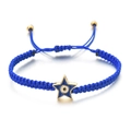 Detail of woven dark blue cord bracelet with gold pentagram evil eye charm and adjustable beads - Dark Blue