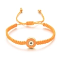 Détail du bracelet corde tressée orange avec pendentif œil maléfique émaillé double face - Orange