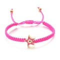 Detail of pink hand-woven bracelet featuring a pink enamel star with the evil eye symbol - Rose Red