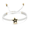 Detail of white woven bracelet with a star-shaped gold charm and evil eye enamel design - White