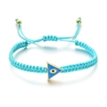 Detail of hand-woven cord bracelet featuring a blue triangular evil eye enamel pendant - Blue