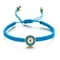 Bracelet œil porte-bonheur bleu tissé à la main avec cordon ajustable et détails dorés - Bleu lac