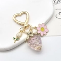 Porte-clés cœur doré avec fraise aurore violette et breloques de marguerites roses - Fraise Aurore Violette Anneau Cœur