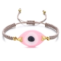 Detailed view of pink evil eye charm on adjustable woven rope bracelet with gold beads - Khaki Rope Pink Eye (QQSL012-17)
