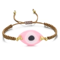 Detailed view of pink Evil Eye pendant on a brown braided adjustable Greek bracelet - Brown Rope Pink Eye Charm (QQSL012-19)