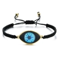 Detailed view of woven black Evil Eye bracelet with adjustable cord and gold metal charm - Black Rope Tricolor Eye (QQSL012-25)