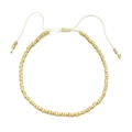 Detail view of Bohemian cream and gold beads with an adjustable white woven cord closure - Beige Gold With White Cord (QQ434)