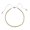 Detail of bohemian handmade beaded bracelet with grey matte beads and gold spacers - Gray Gold With Gray Cord (QQ444)