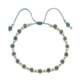 Detailed macro view of bohemian faceted blue stone beads on an adjustable braided cord bracelet - Klein Blue (QQ299)