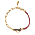 Detail of a gold paperclip chain and red beads bracelet with a high heel pendant charm - Red