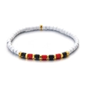 Detail of colorful beads on white cylinder bracelet with golden metallic accents - Minimalist Bohemian White Tone Style (XN201 (2))