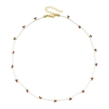 Detail of white beaded necklace with red cherry charms and golden lobster clasp - Cherry White Style (SL1544)