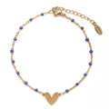Detail of gold stainless steel heart bracelet featuring blue beads and S.steel hallmark - Blue