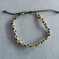 Detail of hand-woven bracelet with gold beads and black faceted stones in wave pattern - Handwoven Wave Pattern Black and Gold Alternating Style (XN515-4)