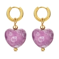 Detailed view of heart-shaped purple ceramic pendants on golden hoop earrings - Purple Marble Print
