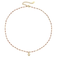 Detailansicht der Gold-Edelstahlkette mit roten Perlen und rundem Kristallanhänger - Goldkette Rote Perlen (XN0153-3)