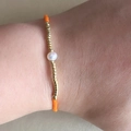 Adjustable Miyuki beaded bracelet with orange beads and a single white pearl - Orange