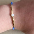 Golden Miyuki bead bracelet with a central white pearl and blue accents for women - Sky Blue