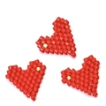 Three handmade red MIYUKI glass bead heart charms with gold accents on white background - Red Style (MYK018-1)