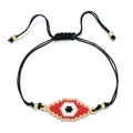 Handmade woven bracelet featuring a red and gold Evil Eye bead charm on a black cord - Red and White Evil Eye Style (SL030-12)