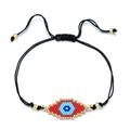 Handmade woven Evil Eye bead bracelet with black cord and gold metallic accents - Red and Blue Evil Eye Style (SL030--4)