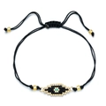 Handmade woven black cord bracelet featuring a turquoise evil eye bead and gold accents - Green Center Eye Style (SL030--5)