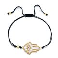 Handmade beaded bracelet featuring a white and gold Hamsa hand with adjustable black cord - Purple Center Hamsa Hand Style (SL030-8)
