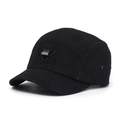 Close-up of black cotton camp cap featuring a triangular metal logo and metal eyelets - Adjustable / Black