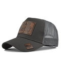 Detail of grey mesh trucker hat featuring DAD leather patch and breathable mesh structure - Dark Gray