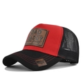 Detail of red trucker hat featuring leather patch with engraved DADDY slogan and mesh back - Black and Red