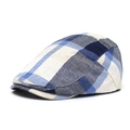 Close-up of the woven texture and patchwork plaid pattern on the vintage flat cap - Adjustable / Blue